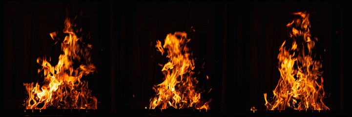 Bright fire flame on a dark background. Burning fire at night. Bonfire in the barbecue, fireplace and hearth.