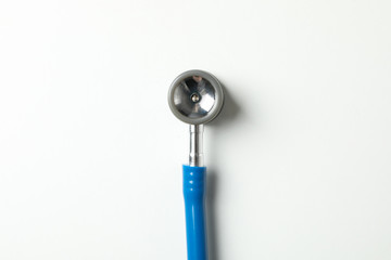Blue stethoscope on white background, space for text
