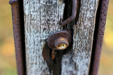Old rusty padlock that closes the gate