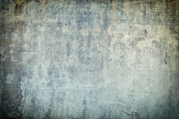 Empty gray background for sites and layouts. Photo with a concrete wall texture in spots and smudges. Toned photo with vignette.