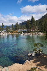 Clear waters of Lake Tahoe in Sand Harbor State Park with boulders sticking thru the water