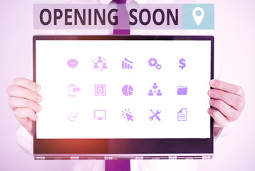 Word writing text Opening Soon. Business photo showcasing an act or instance of making or becoming open to the public Male human holding thick textured cardboard of business promotion concept