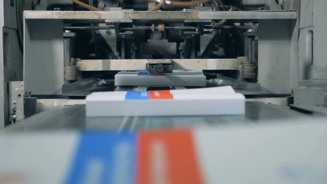 Finished books are getting issued by the printing press