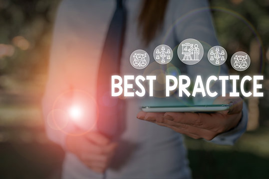 Conceptual hand writing showing Best Practice. Concept meaning Method Systematic Touchstone Guidelines Framework Ethic Woman wear work suit presenting presentation smart device