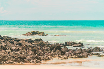 Tropical beach with turquoise ocean waves and white sand. Holiday, vacation, paradise, summer vibes. Shot in Tortuga Bay, San Cristobal, Galapagos Islands.