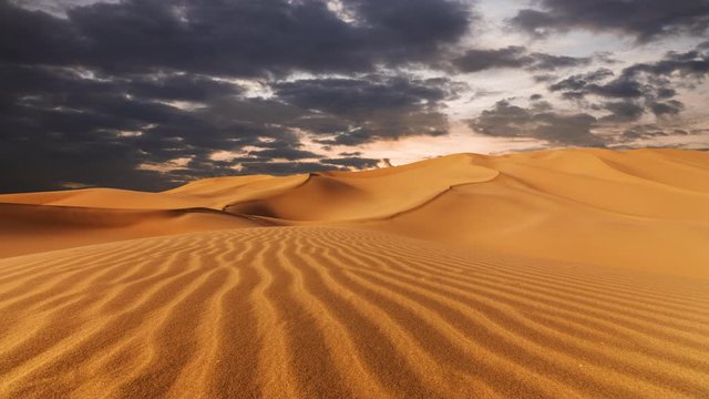Sunset over the sand dunes in the desert