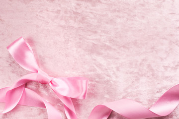 Silky satin plush pink backround with atlas pink bow and ribbon