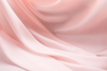 Obraz premium Silky light rose creamy ecru folded background