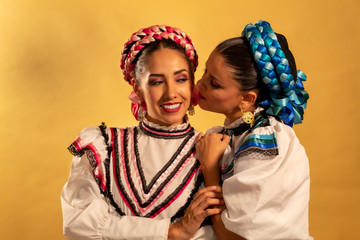 Mexican adelitas Young gay couple lesbian love hug  culture costume typical white