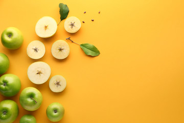 Fresh ripe apples on color background