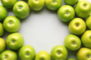 Frame made of fresh ripe apples on light background