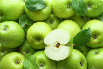 Many fresh ripe apples with water drops