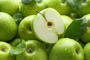 Many fresh ripe apples with water drops
