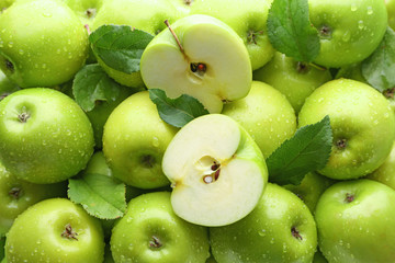 Many fresh ripe apples with water drops