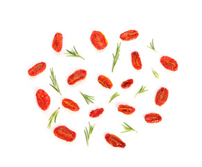 Dried tomatoes and herbs on white background