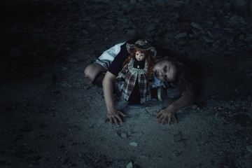 scary girl with a doll in an abandoned house.tinting and noise