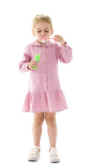 A little girl catches soap bubbles.