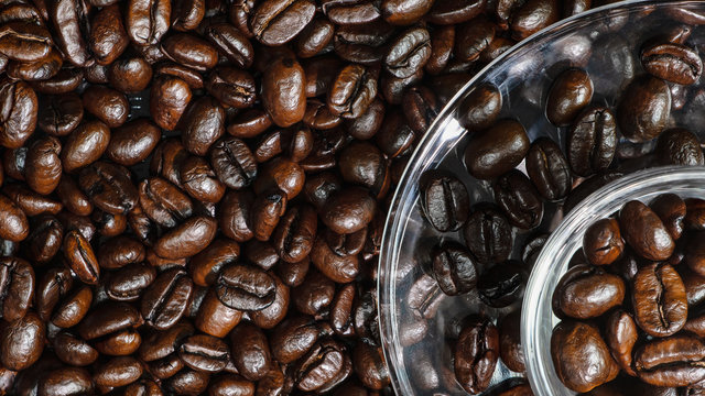closeup background of arabica coffee beans in coffee cup