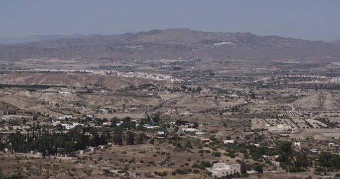 Establishing long shot of a valley near the town of Mojacar in Andalusia, Spain by summer.