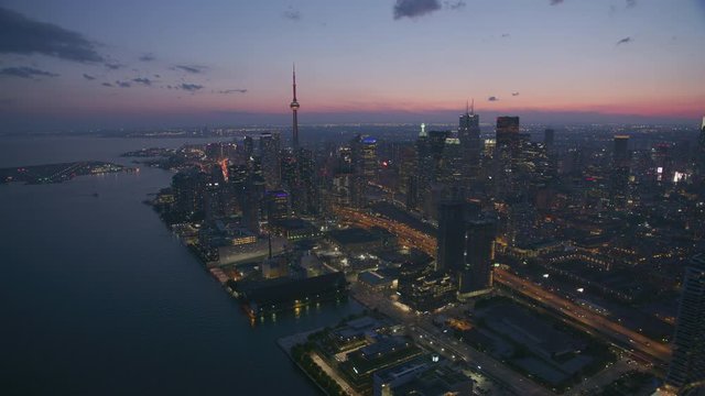 Toronto, Canada circa-2019.  Aerial view of Toronto at dusk.  Shot from helicopter with Cineflex gimbal and RED 8K camera.