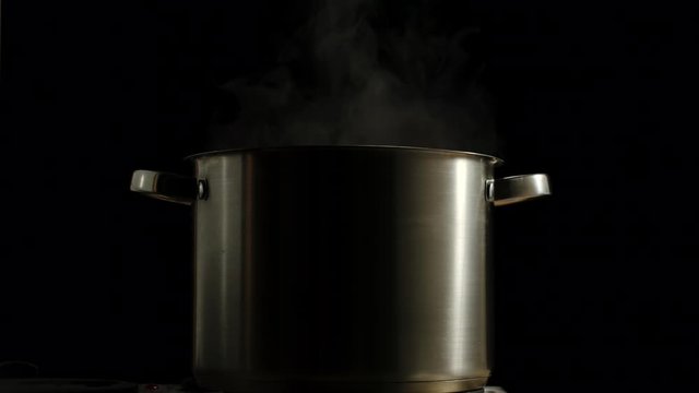 SLOW MOTION: Large Saucepan Boiling With Steam