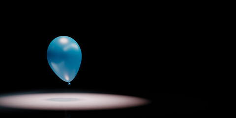 Blue Balloon Spotlighted on Black Background