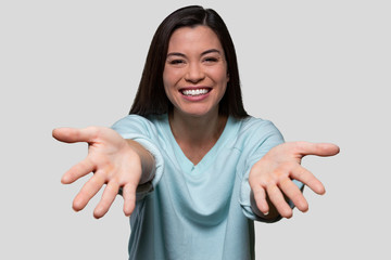 Warm and friendly woman reaching her arms and hands out, welcoming an embrace, giving, receiving, welcoming, child's POV perspective