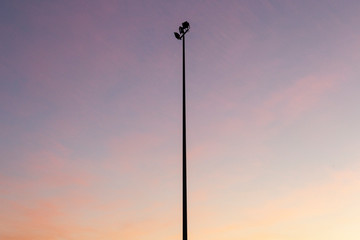 Sporting field light tower turned off during golden hour light.