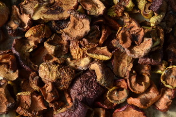 The background consists of dry sliced ​​apples and pears for making compote.