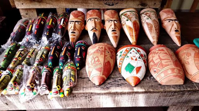 1)	Terracotta  facets  displayed on a gallery bench on the road side shop.