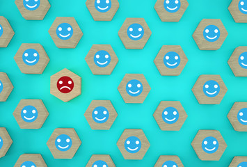 Abstract of face emotion happiness and sadness, Unique, think different, individual and standing out from the crowd concept. Wooden hexagon with icon on blue background.