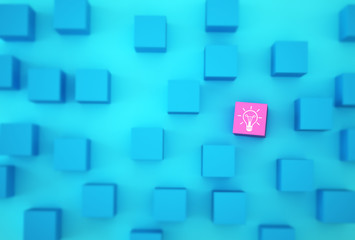 Creative idea and innovation. Light bulb revealing an idea with pink cube box with on blue background.