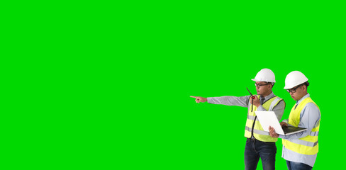 Safety officer holding Walky talkie on greensceen.