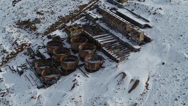 A drone orbits the rusty Old Tintic Mill in Geneloa, Utah, revealing the decaying water tanks, leaching tanks, roasters and crusher built in 1920.