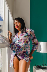 brunette girl in underwear in sensual and seductive poses, showing her beauty and attractive hot body