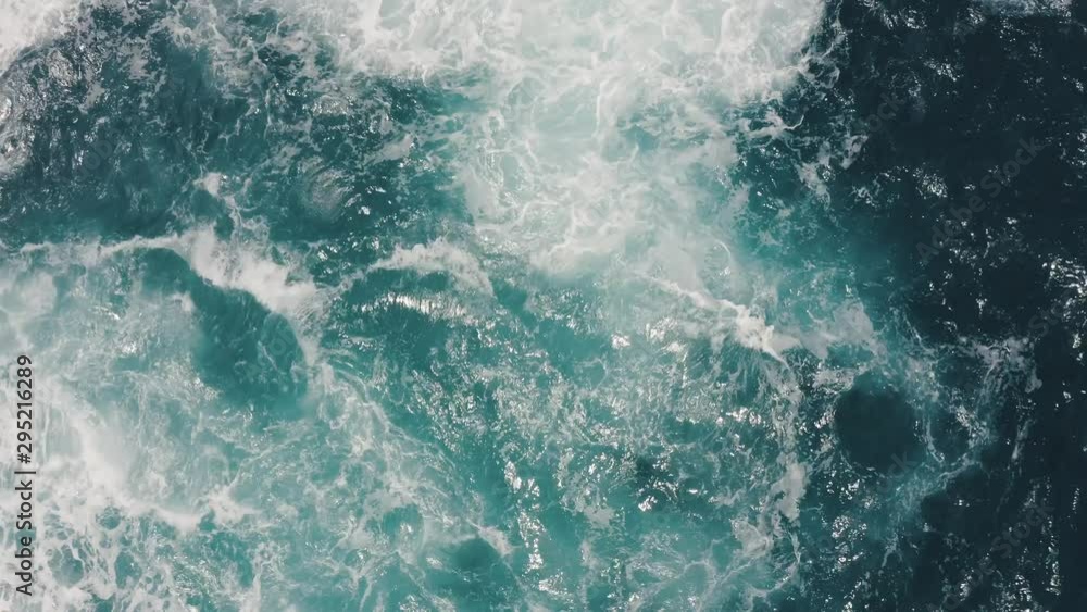 Poster top view of giant waves splashing and foaming in the ocean