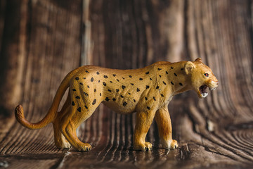 figure of a toy Cheetah on a wooden background