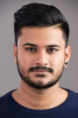 Obraz premium Face of young handsome Indian man looking at camera