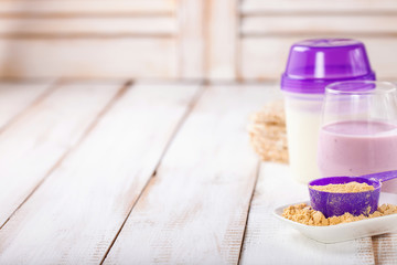 Protein and milk for milkshake. Sports food. Selective focus.