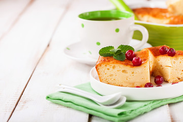 Cottage cheese casserole on a light background. Selective focus. Copy space