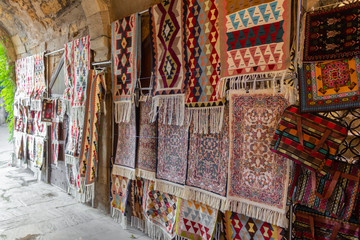 Street bazaar of ancient oriental handmade Garabagh, Tabriz, Shirvan style carpets, rugs at Old...