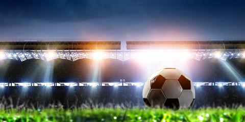 Empty night football arena in lights