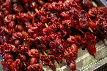 octopus mini satay on grill