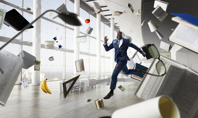 Cheerful businessman jumping high. Mixed media
