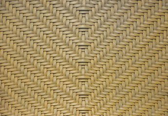 brown rattan woven in arrows pattern texture for background.