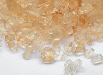 Macro Photo of Pile of Brown Sugar on White Floor