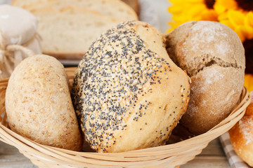 Buns and breads in wicker basket.
