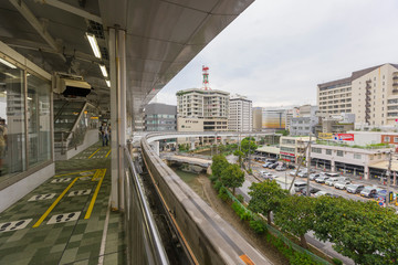 Fototapeta na wymiar Yui Rail or Okinawa Urban Monorail approaching train station in Okinawa, Japan