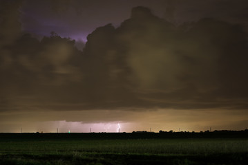 Lightning striking down from a distant thunderstorm