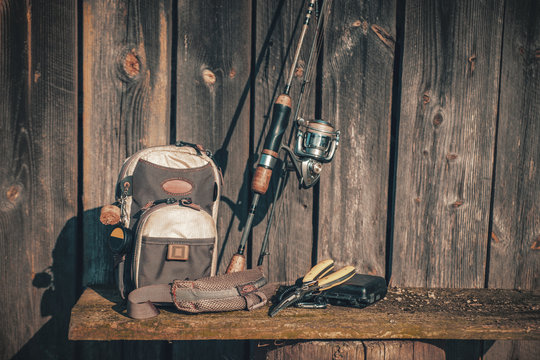 Fishing Tackle On A Wooden Wall Background.